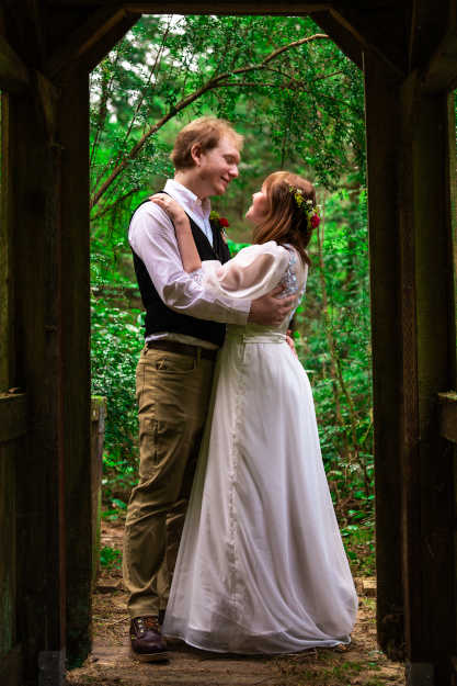 The couple across the little bridge at the campground.